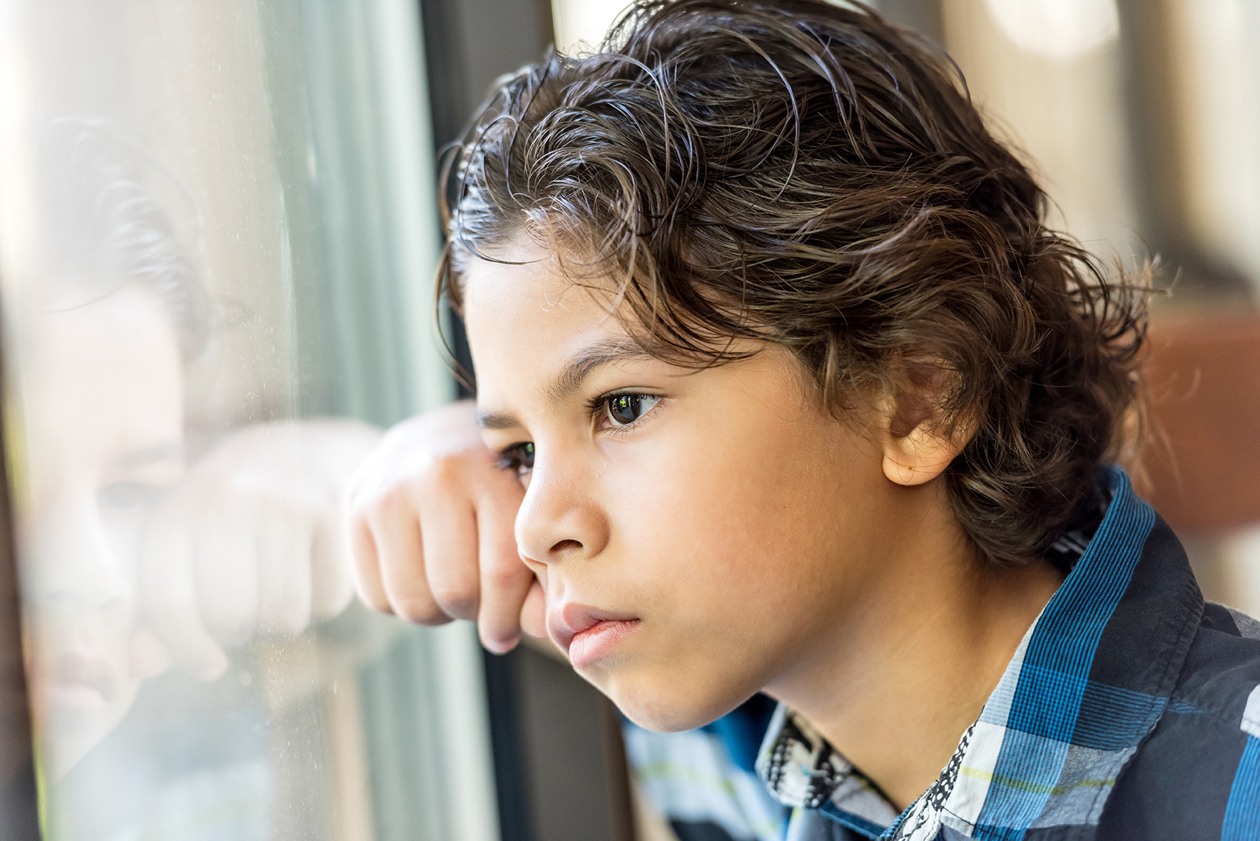 boy looking out window