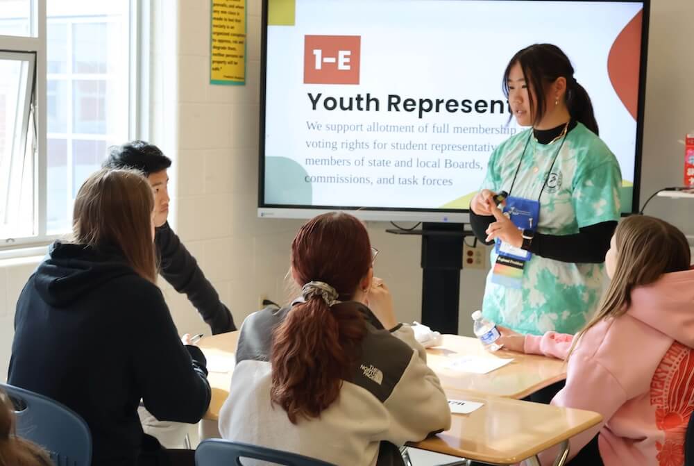 A student leader presents to their peers