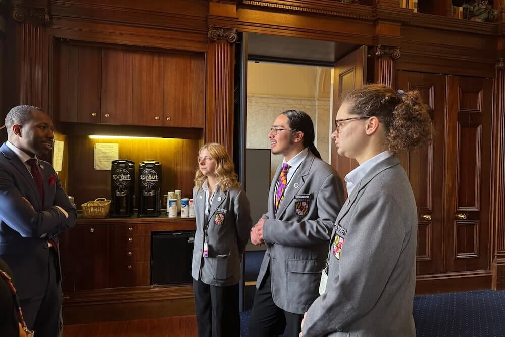 Delegate Jazz Lewis speaks to a group of Student Pages in the House of Delegates lounge