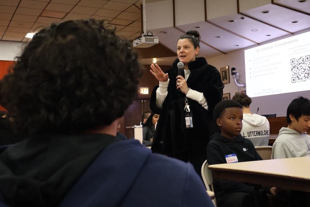 An MCPS Staff Member speaks to an auditorium full of students from the SMOB Advisory Council