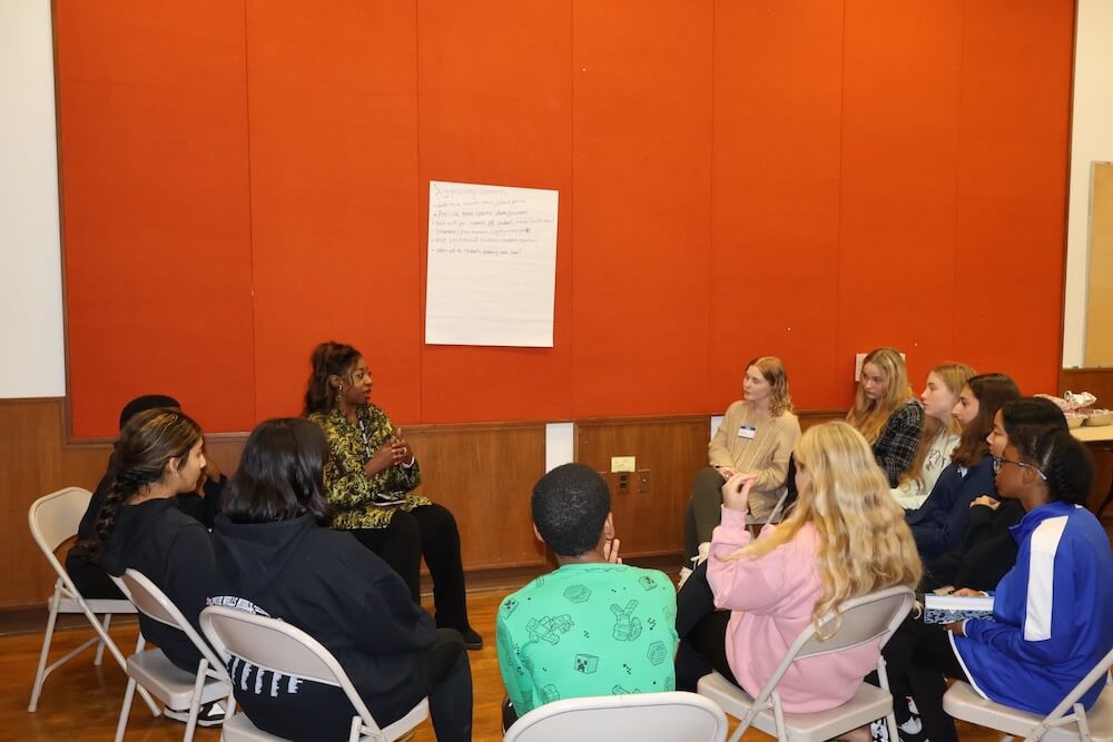 Students from the SMOB Advisory Council have a roundtable discussion with an MCPS Staff Member